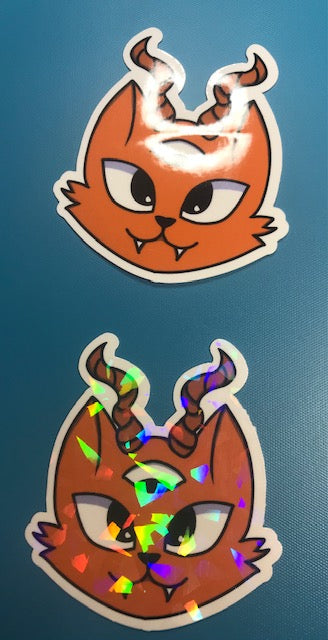 regular or holographic- Orange 3rd eye evil cat
